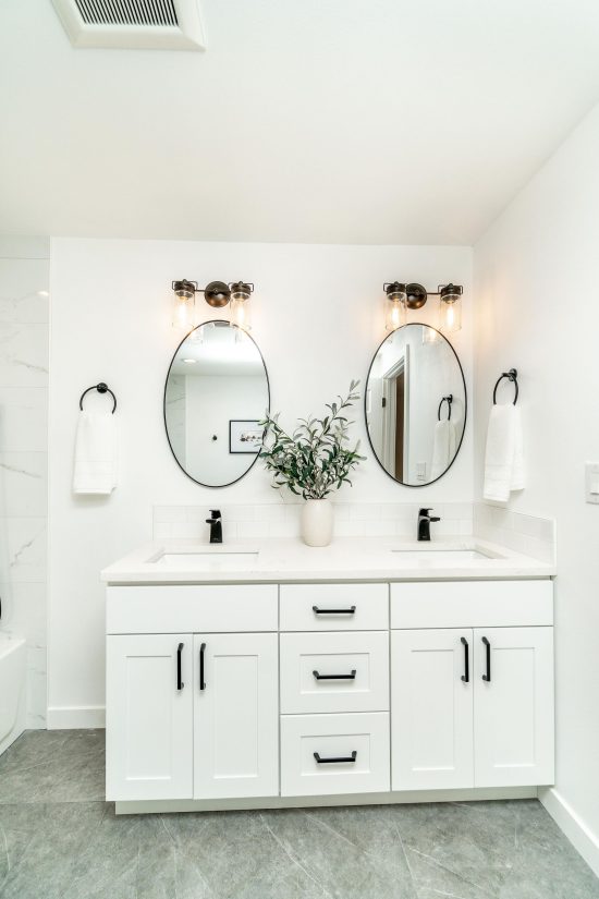 View Of Two Identical Bathroom Sinks And Mirrors