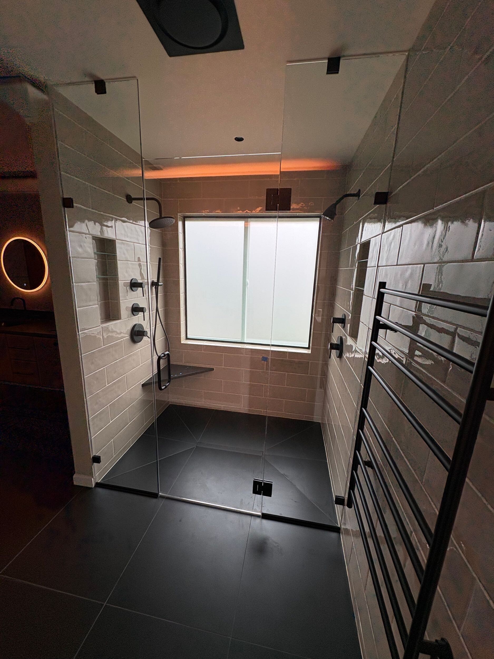 Finished walk-in shower with niches and glass shelves three suite remodel Bothell
